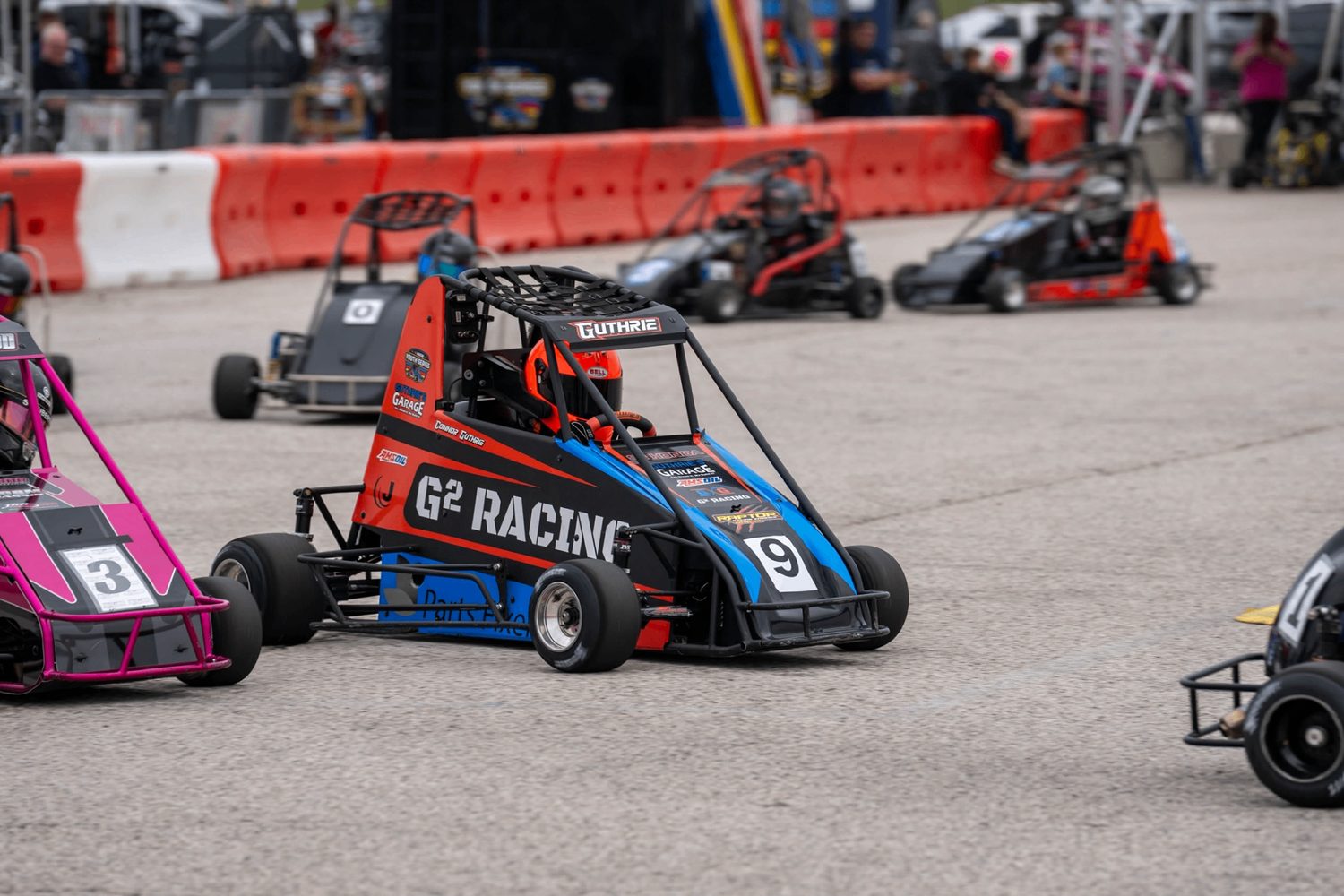 Quarter midgets racing side by side